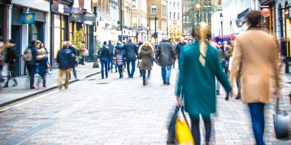 Shoppers walking busy high street