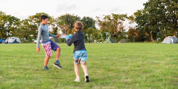 Siblings play ball in a playground - Siblings Contact and the Law