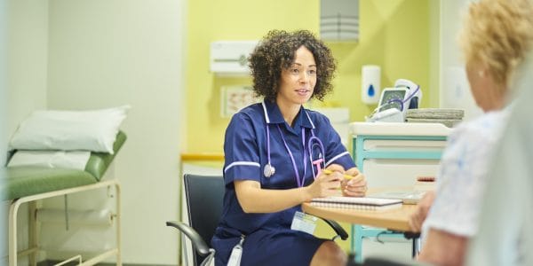 Female-nurse-sees-patient-in-office-Integrating-enriched-longitudinal-data-North-Staffordshire-Stoke-on-Trent-PROJ