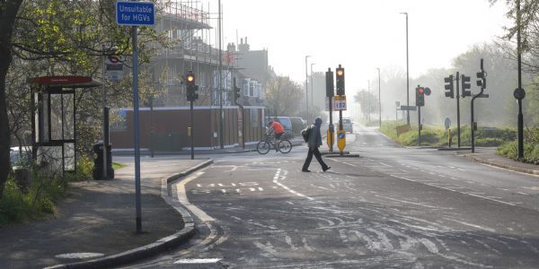 Empty-street-with-cyclist-and-pedestrian-in-distance-Law-and-compliance-during-COVID-19-PROJ