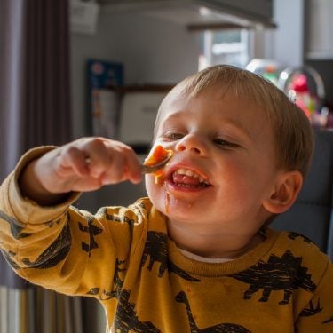Toddler-gleefully-eats-baked-beans-How-COVID-19-is-affecting-food-security-proj