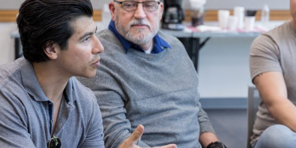 Three men in cognitive behavioural therapy group