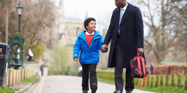 Father Walking Son To School Along Path