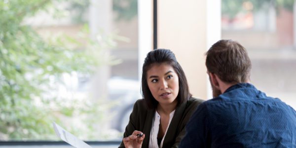 Lawyer taking witness statement from male witness
