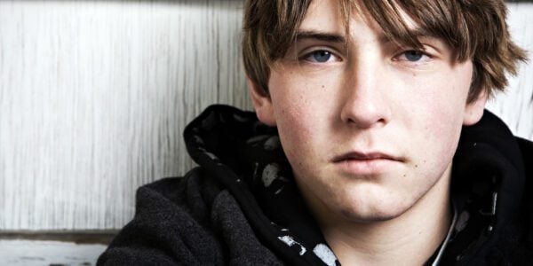 Examining the impact of PACE on the detention and questioning of young suspects: a teenage boy looking at the camera