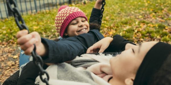 Two sisters, 9 and 14, play on a swing together: Data and voice to improve children's lives