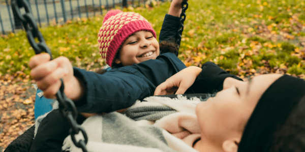 Two sisters, 9 and 14, play on a swing together: Data and voice to improve children's lives