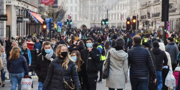 A crowded street with passers-by wearing face masks: Full Fact