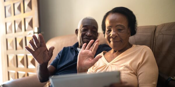 An older couple using a tablet to make a video call: Understanding local legal needs and supporting early intervention