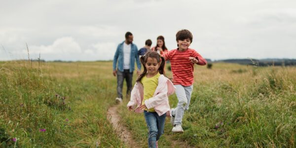 Children walking with their parents in the countryside