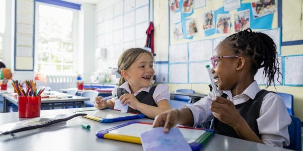 Two girls in classroom at school