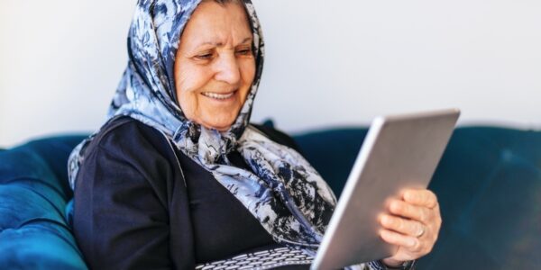Older woman using a tablet to make a video call