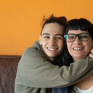 Teenager hugging their mother