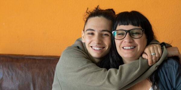 Teenager hugging their mother