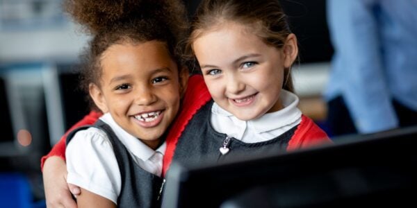 Little girls in primary school uniform