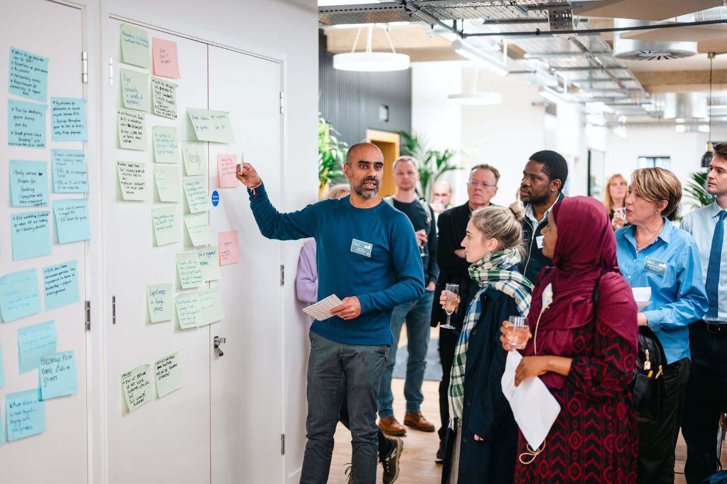 Post-it notes at the ECR event2 Ash Patel summarising ideas on post-it notes with a group of early career researchers