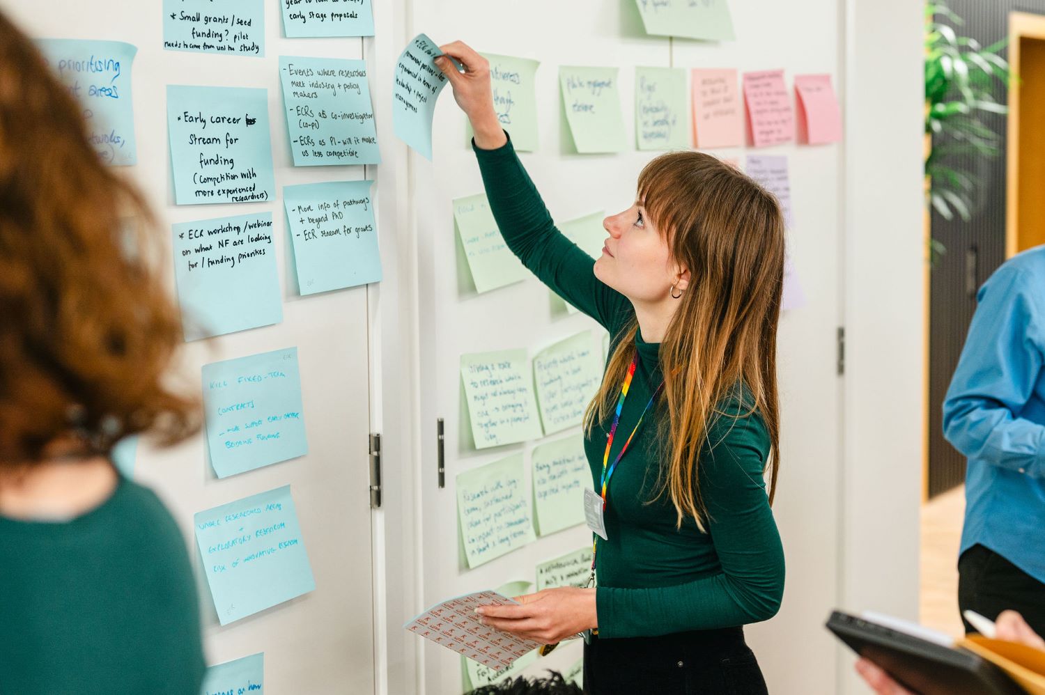 Post-it notes at the ECR event4 Putting post-it notes on the wall at the early career researcher event