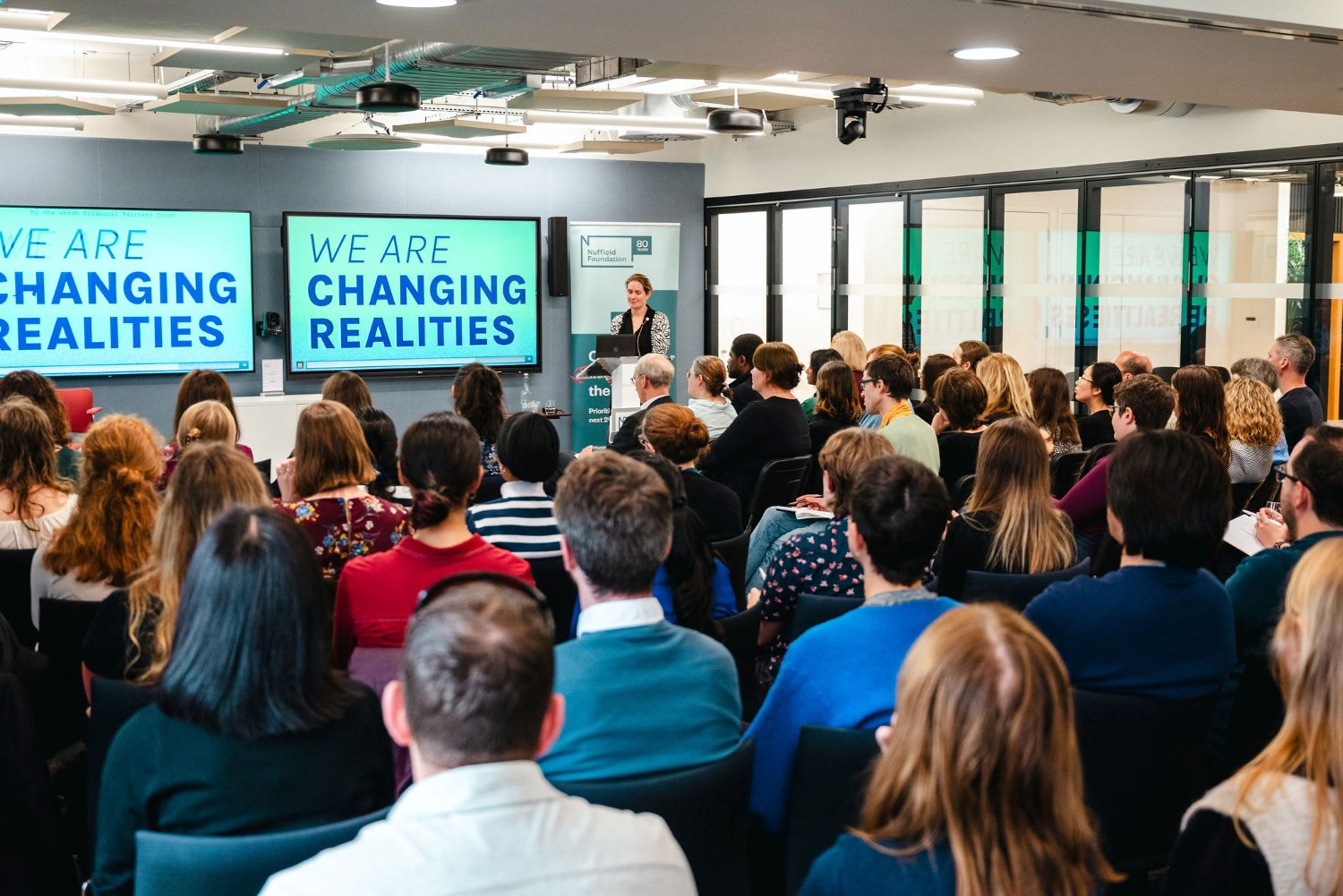 Ruth Patrick presenting on Changing Realities Ruth Patrick presenting on her project Changing Realities, speaking at the front of a packed room