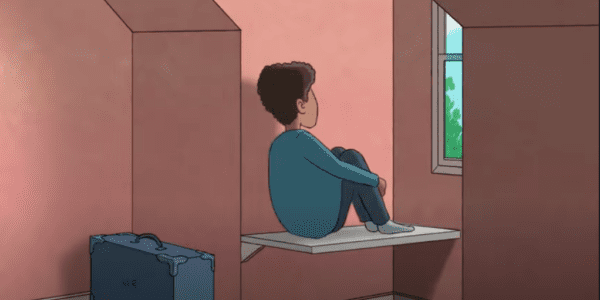 Still from animated video showing a young boy sitting on his own and staring out of the window in his bedroom