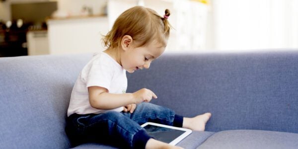 Young girl using an iPad at home