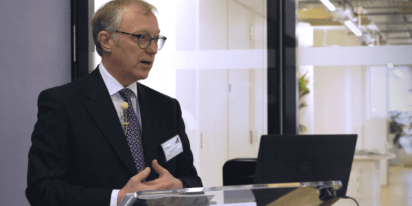 Rt Hon Sir Ernest Ryder standing at lectern giving a keynote speech the Nuffield Foundation offices