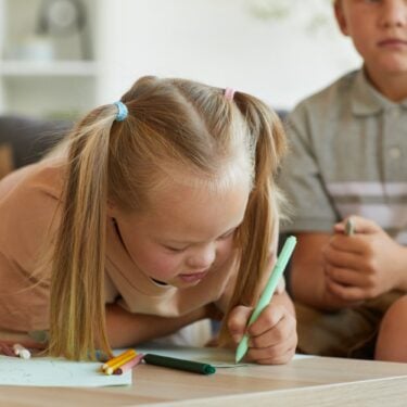 SEND pupil drawing in classroom