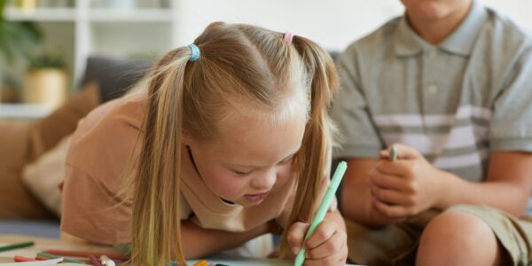 SEND pupil drawing in classroom