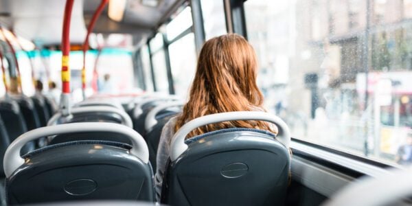 lady looking out of the bus window