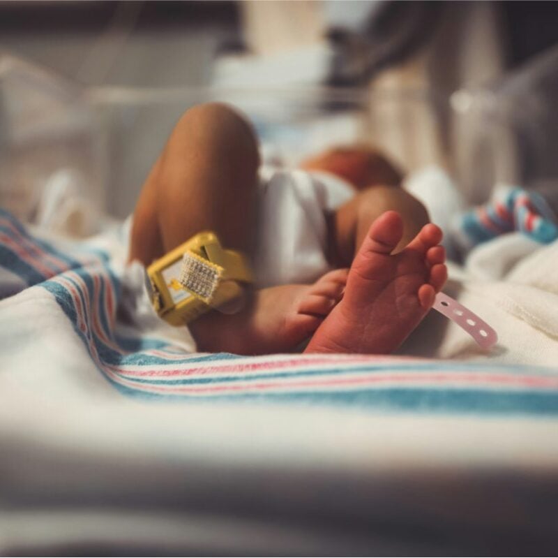 A baby being cared for at hospital.