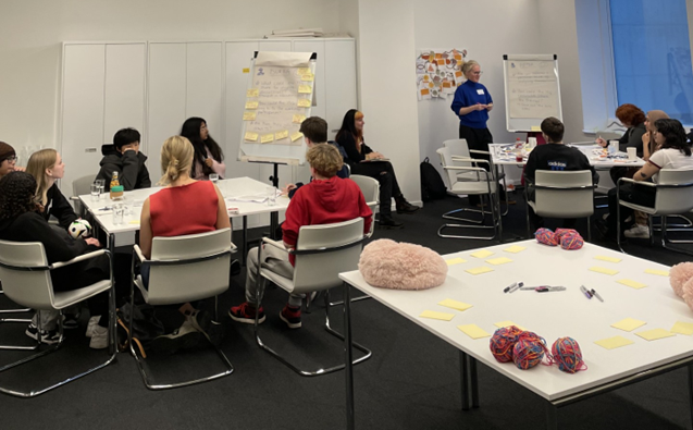 Group of young people around a roundtable