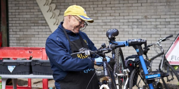 Older man working with a bike